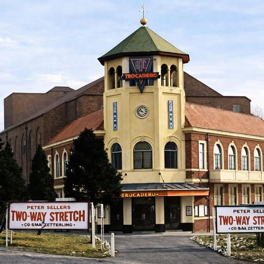 The Trocadero building in Leicester with vintage movie billboards at the front