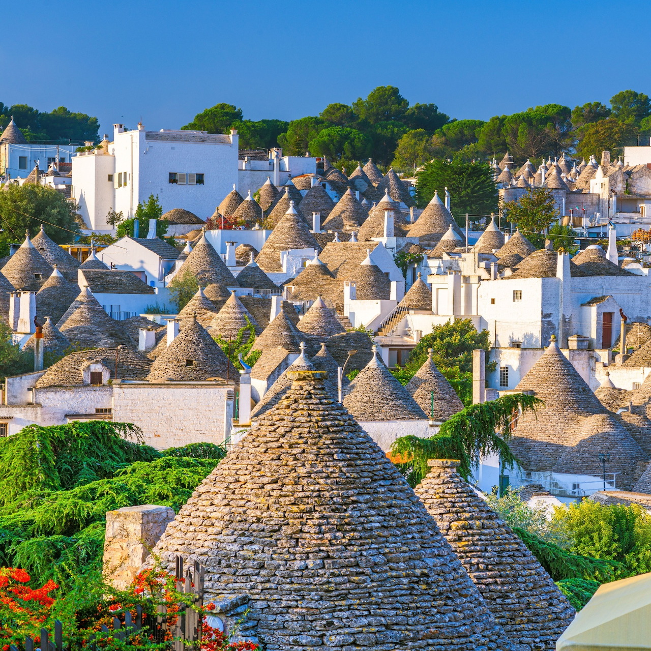 Aerial view of traditional trulli houses with conical stone roofs in Alberobello, Puglia, Italy