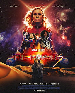 The Marvels movie poster showing three heroes in space suits with cosmic nebula background