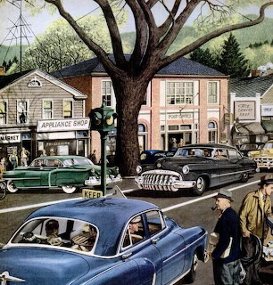Vintage 1950s Main Street with classic cars parked near shops and a central tree