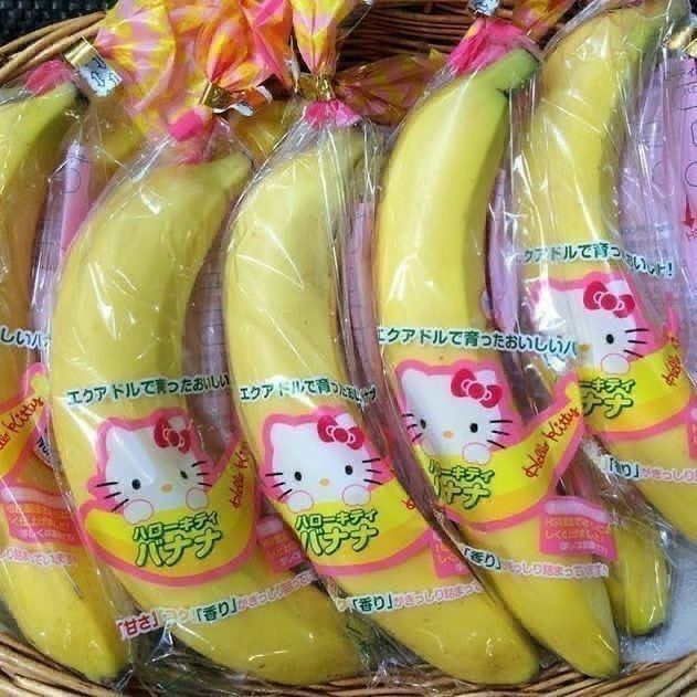 Packaged bananas with pink Hello Kitty labels in clear plastic wrapping