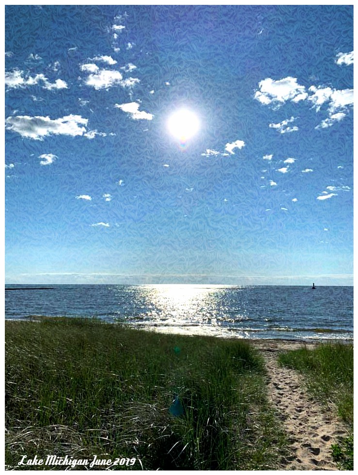 Lake Michigan shoreline with blue water and sandy beach