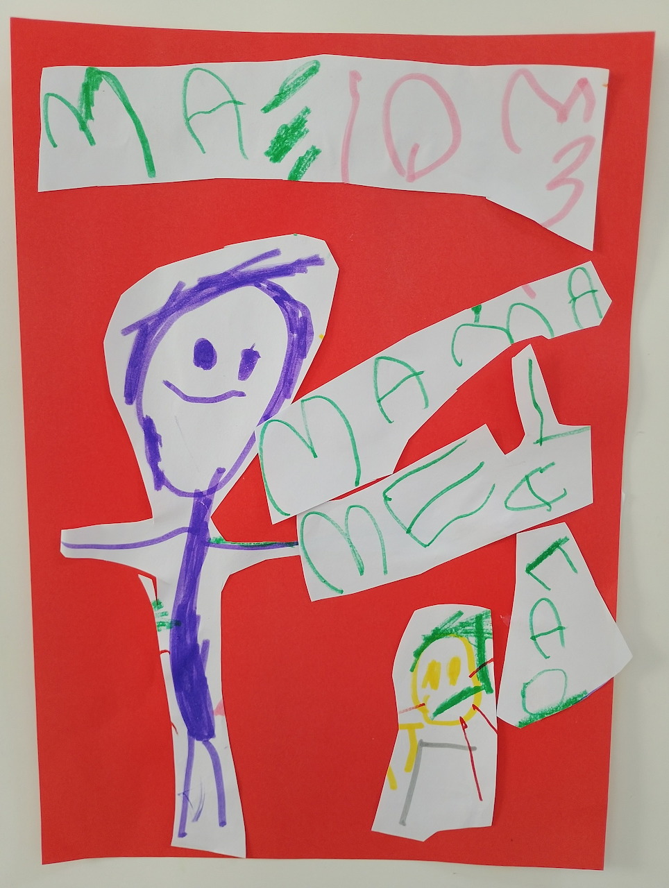 Child's drawing on red paper with a purple stick figure and Greek handwritten text for Mother's Day