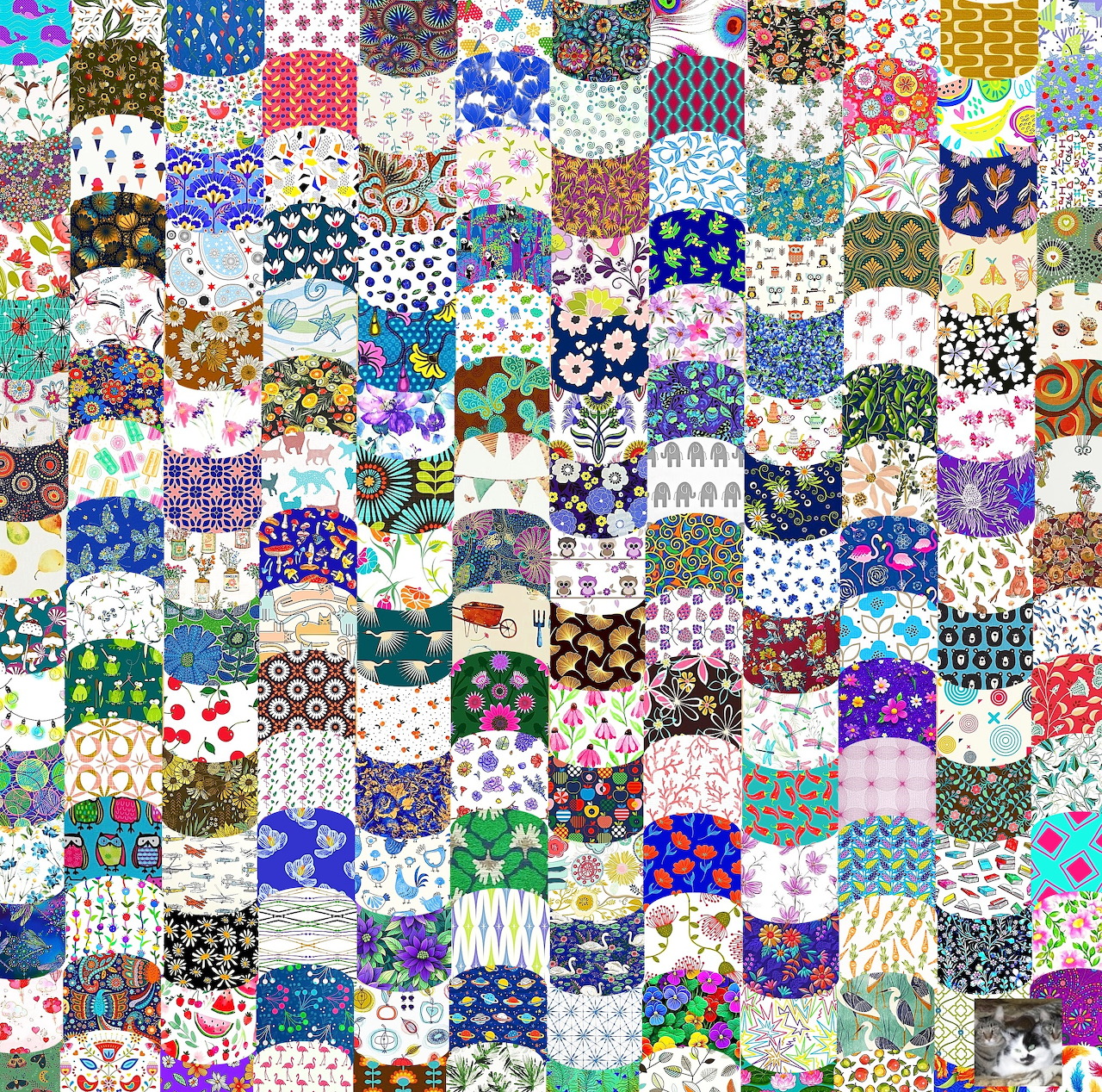 Dense patchwork quilt grid with colorful floral, geometric, and polka dot fabric squares in various patterns and colors