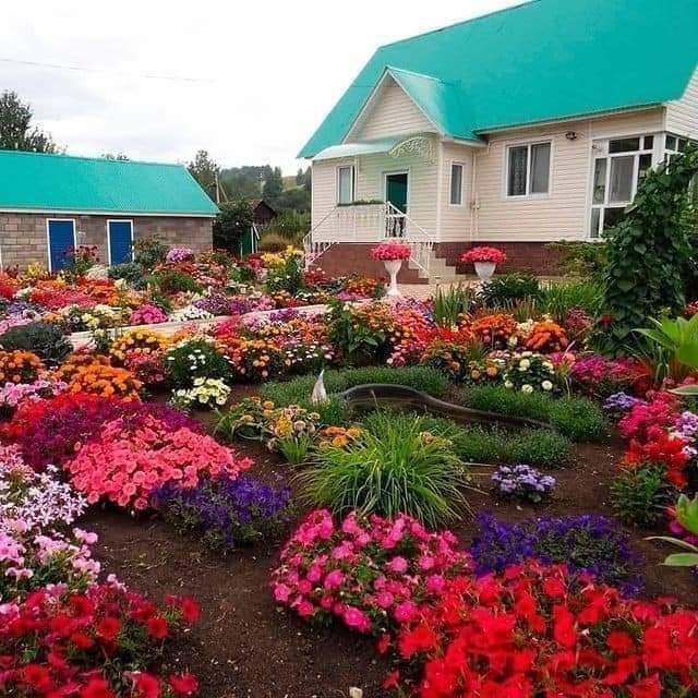 White House with Colorful Flower Garden