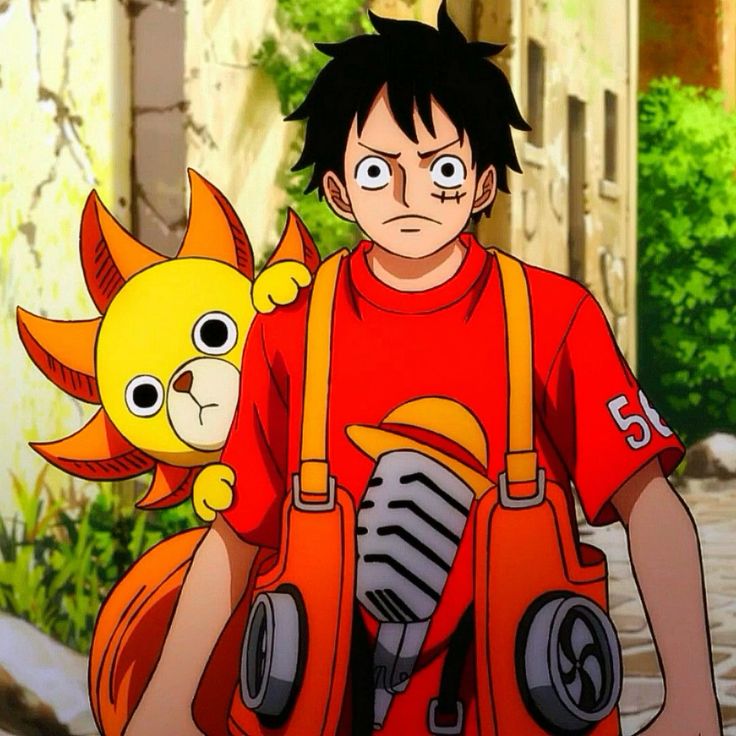 Anime boy in red overalls holding straw hat with yellow sun-shaped ship mascot beside him