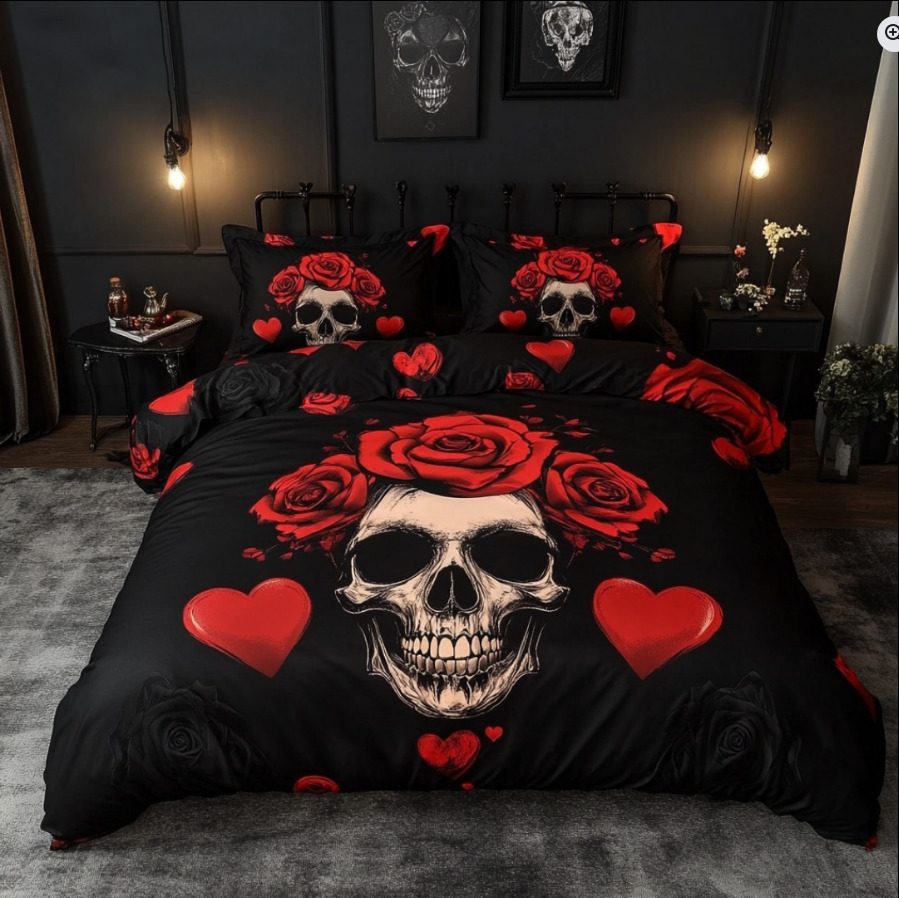 Black bedspread and pillows with skull, red roses, and hearts in a dark bedroom