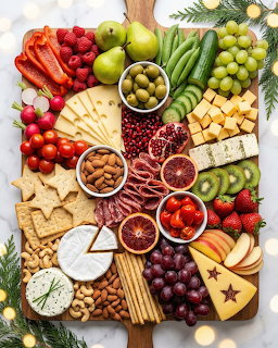 Overhead view of an elaborate charcuterie board with cheese, fruit, crackers, vegetables, and meats