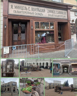 Film crew shooting scene at vintage storefront with Cyrillic signs and equipment visible on urban street