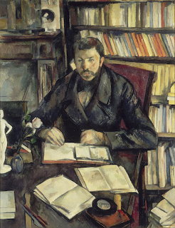 Impressionist portrait of bearded man reading at desk surrounded by books and bookshelves