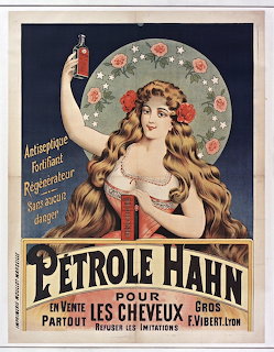Vintage Art Nouveau poster showing woman with long hair holding Pétrole Hahn bottle with ornate floral frame