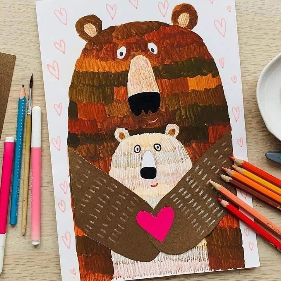 Illustration of parent bear hugging baby bear with heart on wooden table with colored pencils