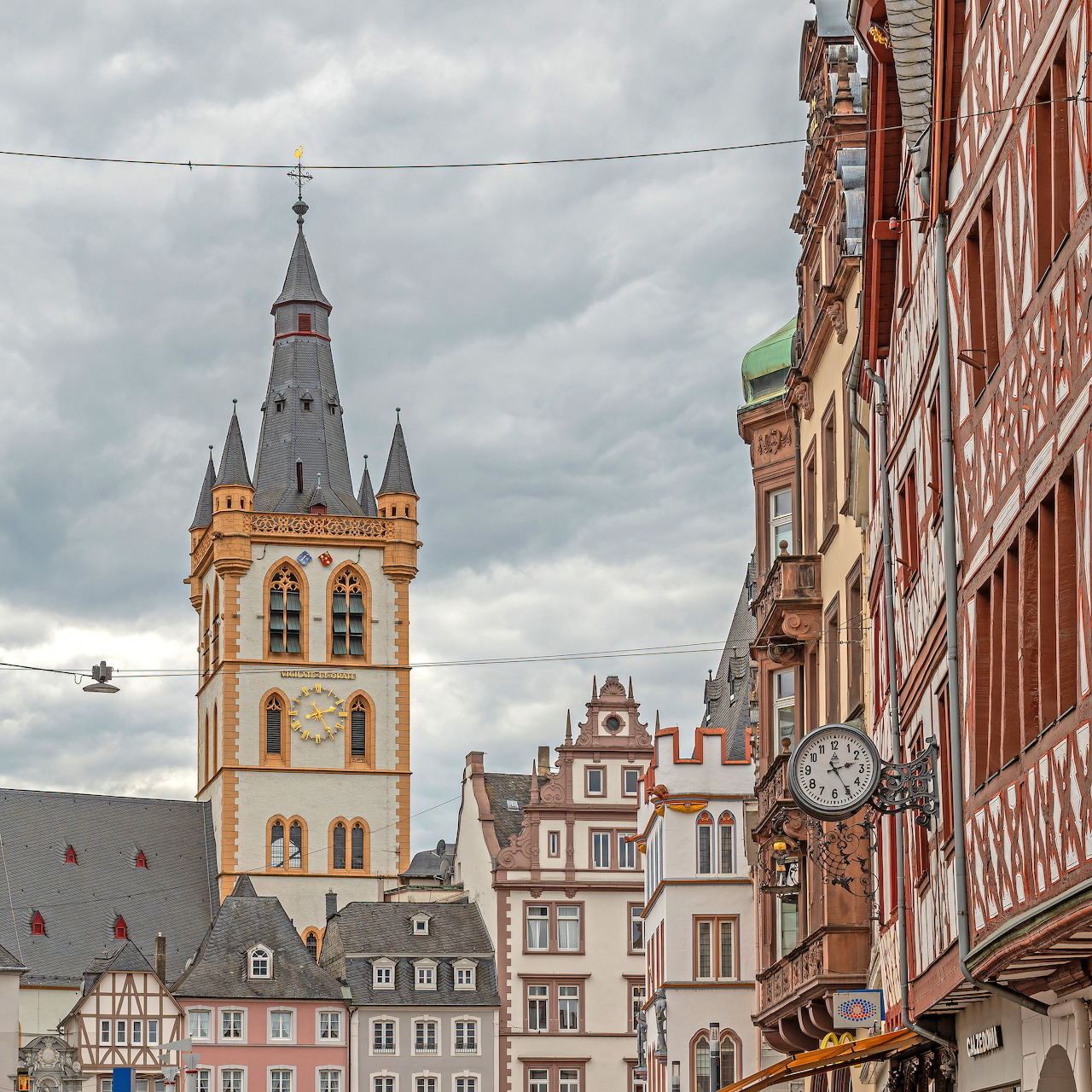 Historic colorful building facades with bell tower in Trier, Germany