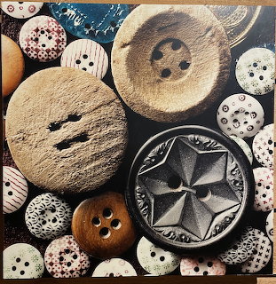 Collection of antique buttons from Steamboat Arabia in various materials, sizes, and patterns