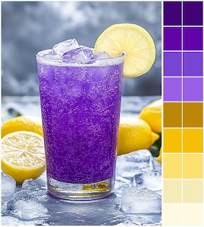 Purple iced drink with lemon garnish in glass surrounded by fresh lemons