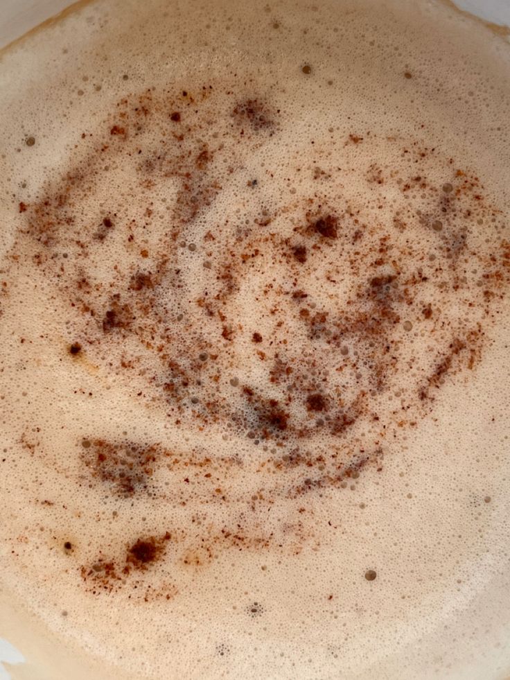 Top view of cappuccino with cocoa powder swirl on foam