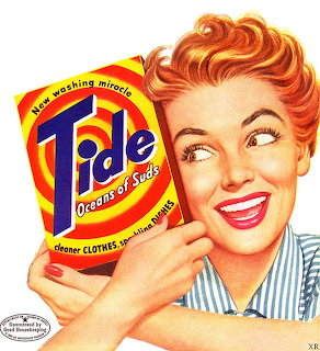 Vintage 1950s Tide detergent ad with cheerful red-haired woman holding orange and blue product box