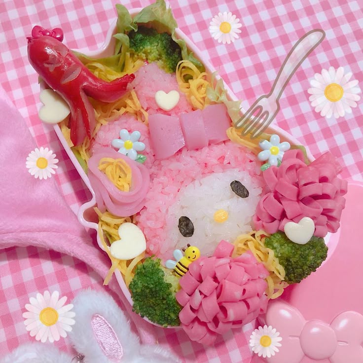 Pink My Melody character bento box with pasta, broccoli, sausage, and flower decorations