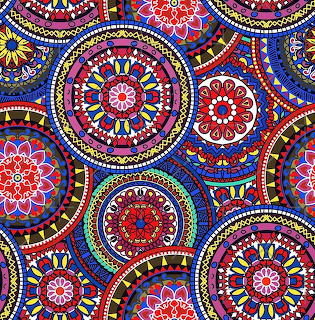 Colorful mandala pattern with intricate circular designs in red, blue, pink and yellow on dark background