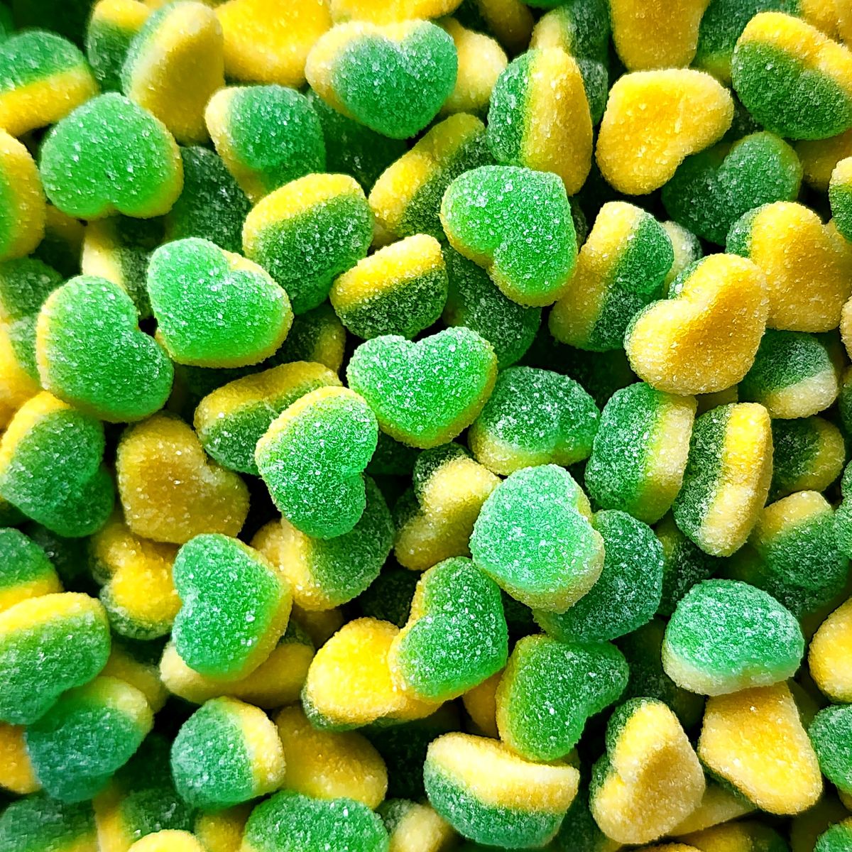 Close-up of green and yellow sugar-coated gummy candies