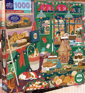 Colorful illustration of a holiday bakery with gingerbread houses, bread, pastries, and Christmas decorations