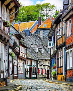 Cobblestone street with traditional half-timbered buildings in historic Goslar, Germany