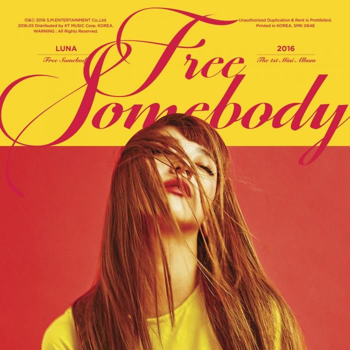 Album cover portrait of Luna with long hair, yellow top, and red background with script text