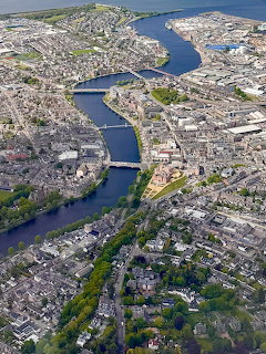 Aerial view of Inverness with the River Ness, bridges, and city buildings