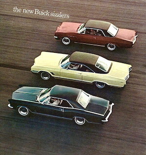 Three vintage 1965 Buick cars viewed from above on a brown background