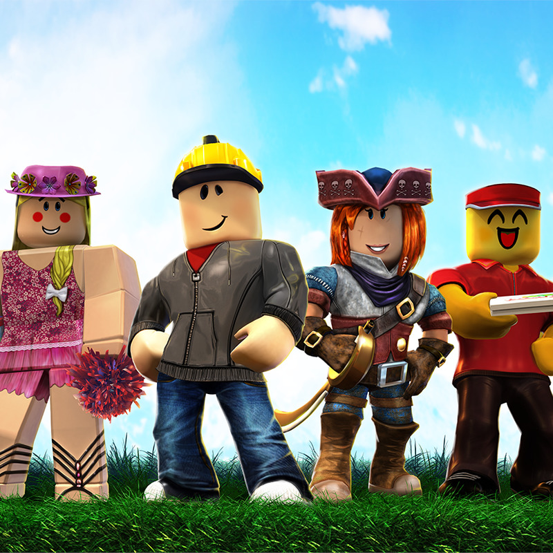 Four Roblox-style characters standing on grass under a blue sky