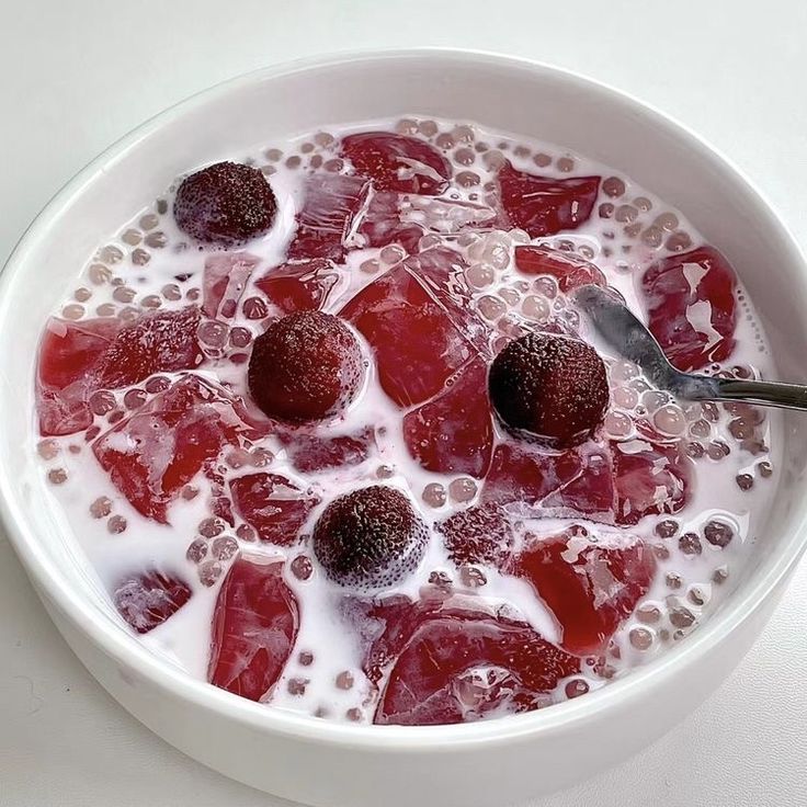 Bowl of berry hwachae with frozen fruit, tapioca pearls, and milk