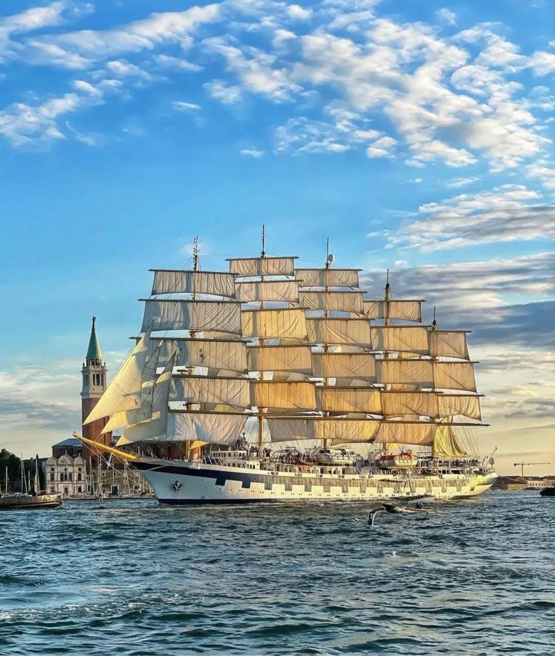 Royal Clipper tall ship with full white sails on the open sea