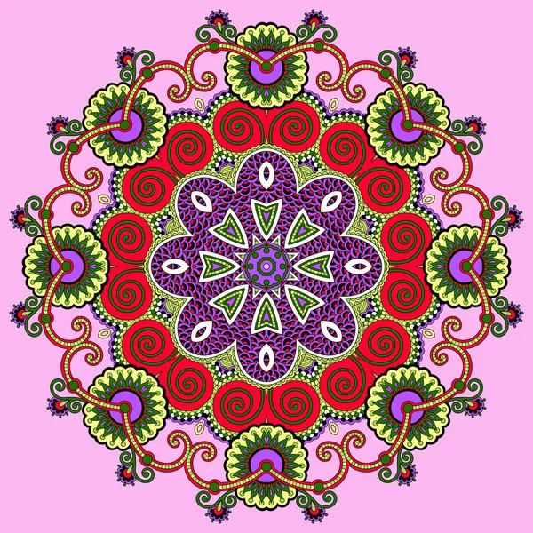 Ornate circular mandala with lace patterns, flowers, and swirls in red, purple, green on pink background