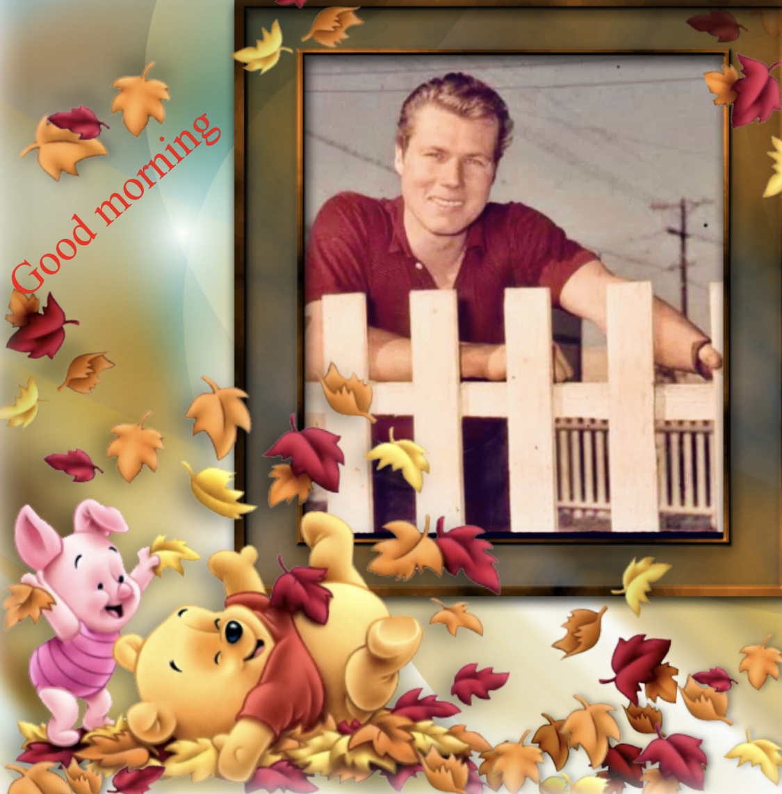 Winnie the Pooh and Piglet with autumn leaves beside a framed photo of a smiling man