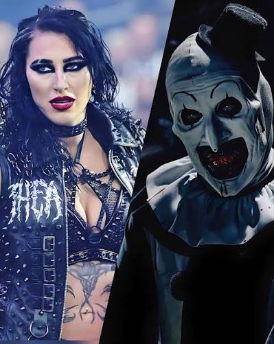 Gothic female wrestler in black with tattoos next to a creepy clown in a dark mask