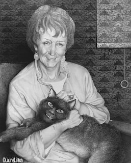 Black and white photo of a smiling woman holding a dark cat with wide eyes indoors