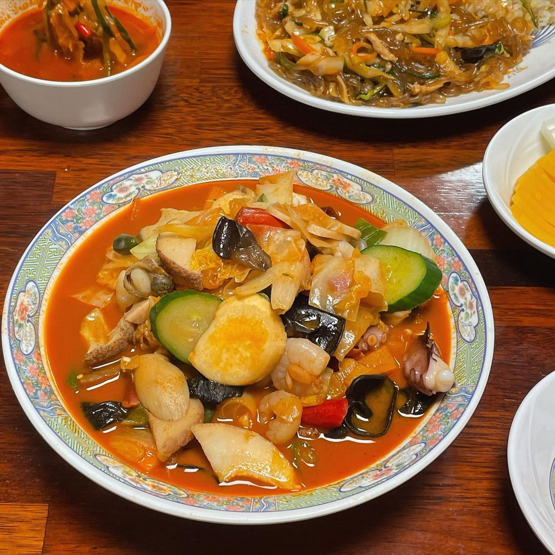 Bowl of jjampong, a spicy Korean seafood noodle soup with vegetables and shellfish