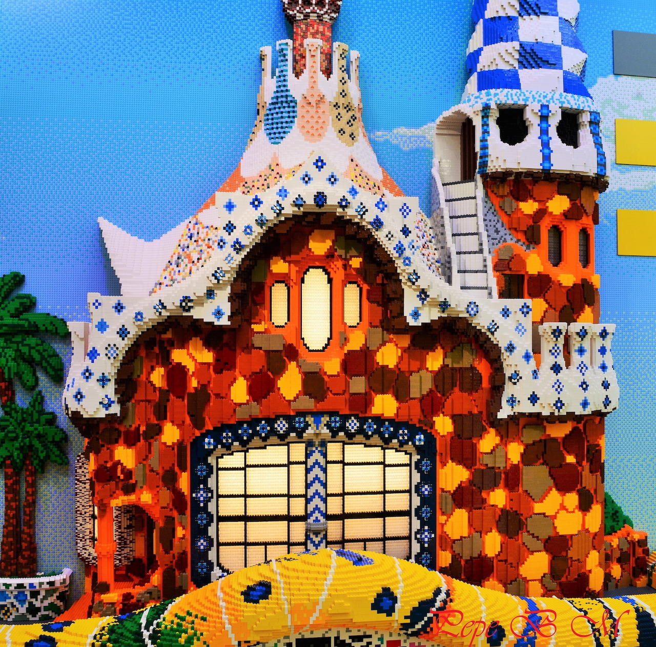 Mosaic gingerbread house at Parc Güell with colorful tile work and ornate towers