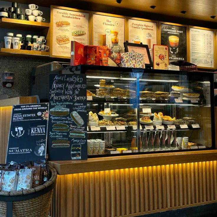 Coffee shop interior with menu boards and a glass pastry display counter