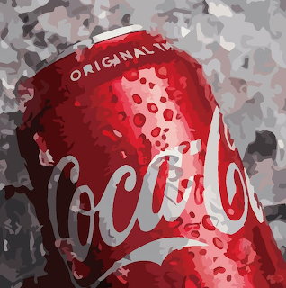 Red Coca Cola can with water droplets against gray camouflage background