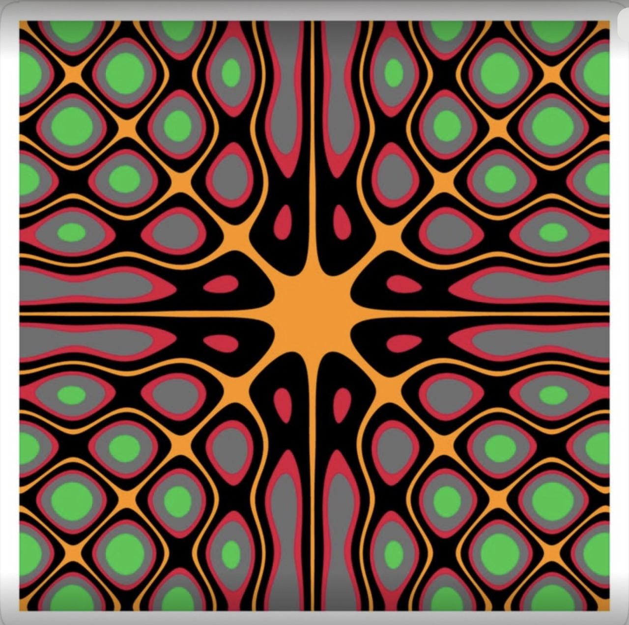 Colorful symmetrical mandala with stained glass pattern in green, red, orange and black