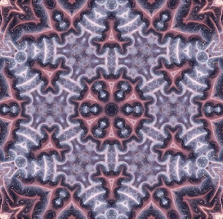 Symmetrical abstract kaleidoscope pattern in purple, pink, and gray