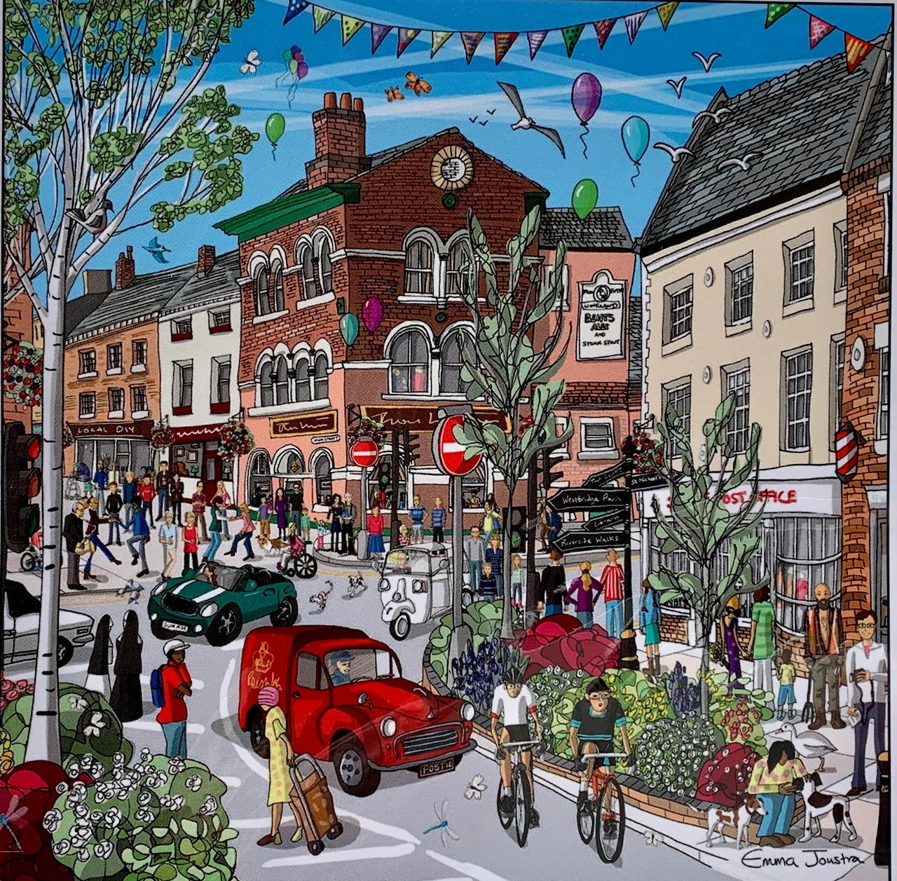 Colorful village street painting with shops, people, bicycles, cars, flowers, and hot air balloons