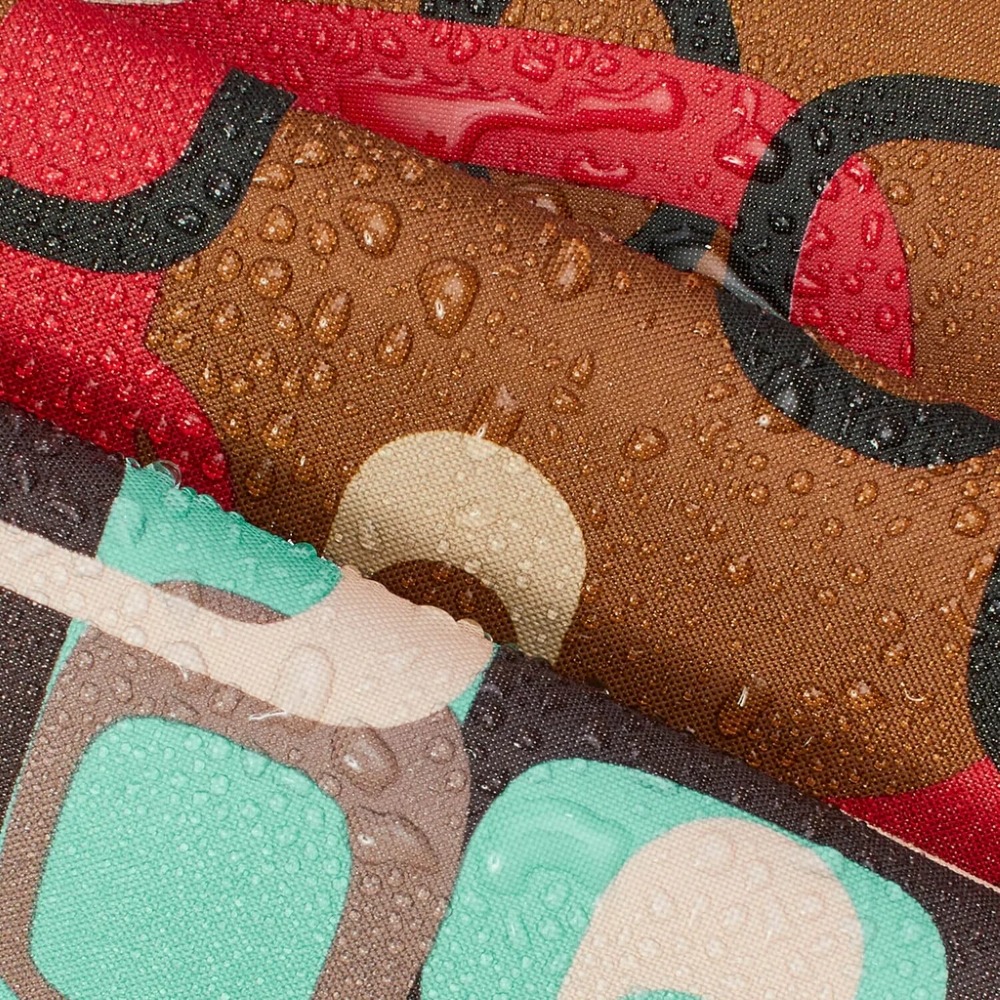 Close-up of colorful printed fabric covered with water droplets