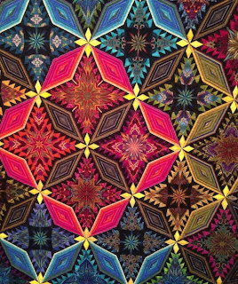 Colorful abstract geometric pattern with repeating diamond and starburst motifs