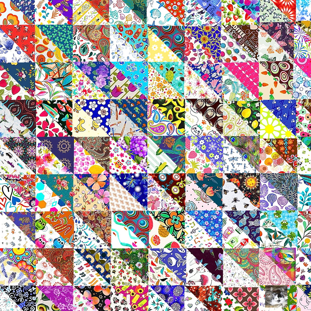 Colorful patchwork quilt with triangular fabric patches in various patterns, florals, and geometric designs