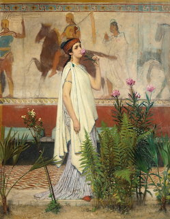 Woman in white Greek dress standing indoors with wall frescoes and potted plants