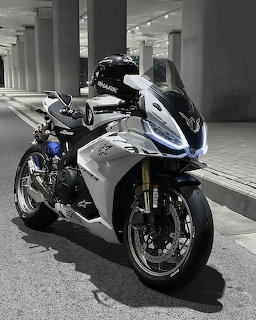 Silver and black Aprilia sport motorcycle parked on an urban street