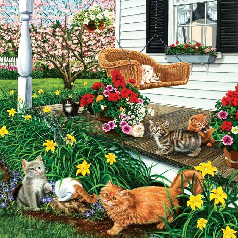Four cats on a porch with colorful flowers and wicker furniture in a spring garden