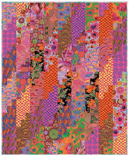 Colorful patchwork quilt with vertical fabric strips in floral and geometric patterns